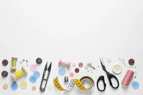Flat lay composition with scissors and sewing supplies on white background. S 스톡 사진