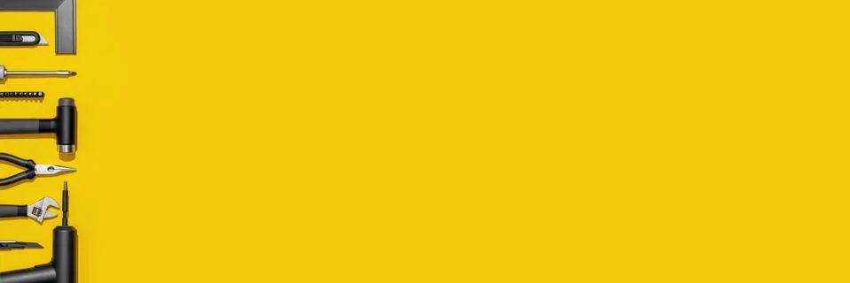 Flat lay composition with set of home repair tools on bright yellow background. Stock Photos