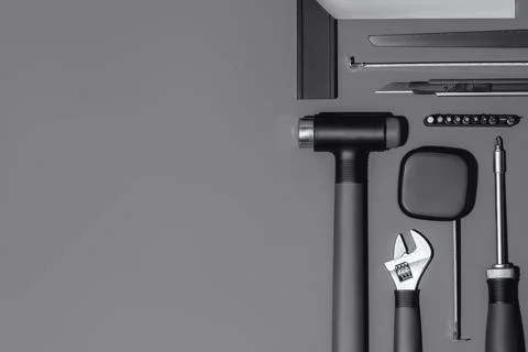 Flat lay composition with set of home repair tools on grey stone background. Stock Photos