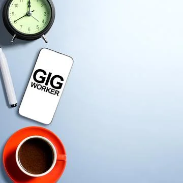 Flat lay composition of a smartphone showing Gig Worker text, a cup of coff.. Stock Photos