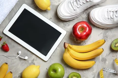 Flat lay composition with sneakers, healthy food, tablet and space for text o 스톡 사진