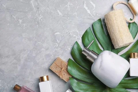 Flat lay composition with soap dispenser on grey marble background. Space for 스톡 사진