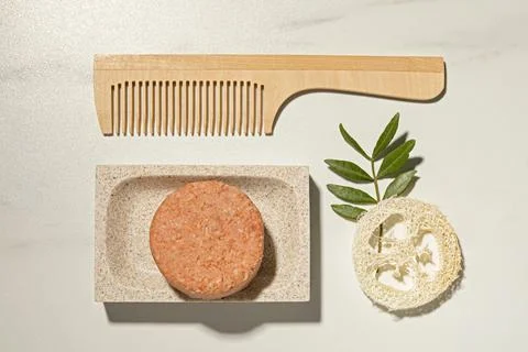 Flat lay composition with solid shampoo bar on white table 스톡 사진
