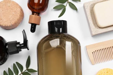 Flat lay composition with solid shampoo bar and bottles of cosmetic product.. Stock Photos
