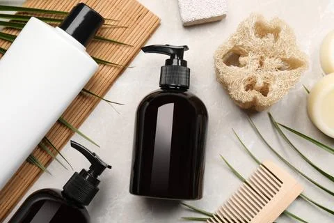 Flat lay composition with solid shampoo bars and bottles of cosmetic produc.. Stockfoto's