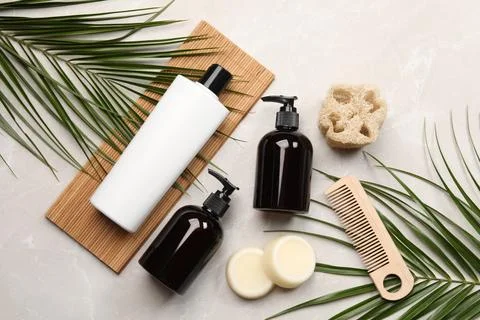Flat lay composition with solid shampoo bars and bottles of cosmetic produc.. Stockfoto's