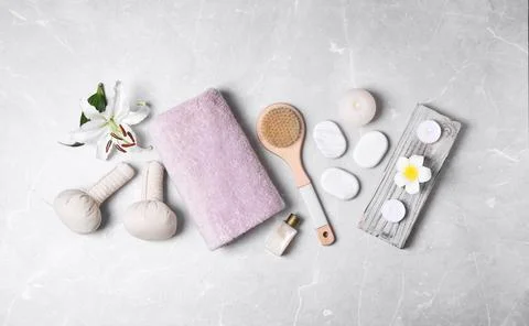 Flat lay composition with spa accessories on light background Stock Photos