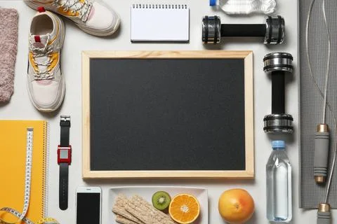 Flat lay composition with sport equipment and blackboard on gray background,  스톡 사진