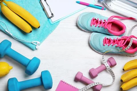 Flat lay composition with sport items, healthy food and space for text on woo 스톡 사진