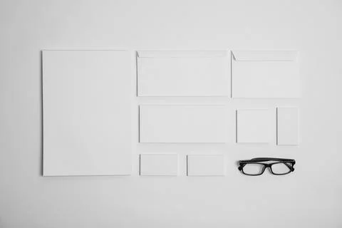 Flat lay composition with stationery on light background. Mock up for design Stock Photos