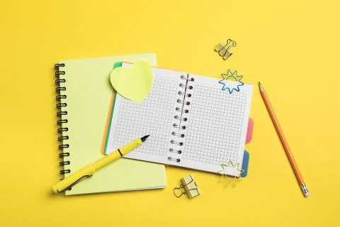 Flat lay composition with stationery on yellow background. Mock up for design Stock Photos