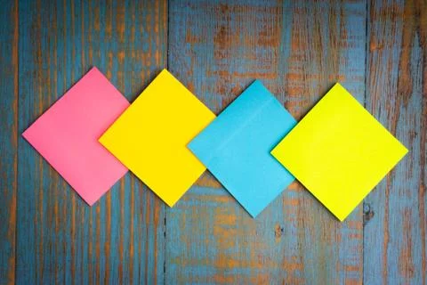 Flat lay composition of sticky notes on the wooden table top view. 写真素材