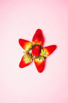 Flat lay composition of strawberries with pink background Stock Photos