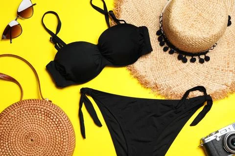 Flat lay composition with stylish bikini on color background. Beach objects Stock Photos