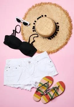 Flat lay composition with stylish bikini on color background. Beach objects Stock Photos