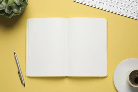 Flat lay composition with stylish notebook on yellow background Stock Photos