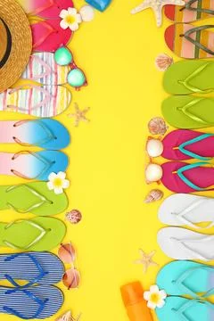Flat lay composition with summer beach accessories on yellow background. Spac Stock-Fotos