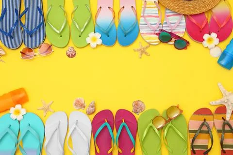 Flat lay composition with summer beach accessories on yellow background. Spac Stock-Fotos