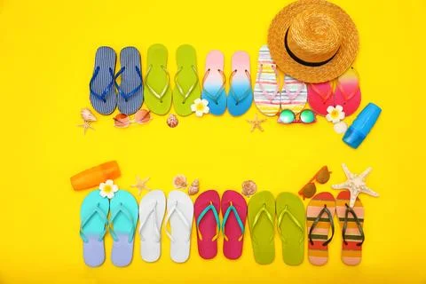 Flat lay composition with summer beach accessories on yellow background. Spac Stock Photos
