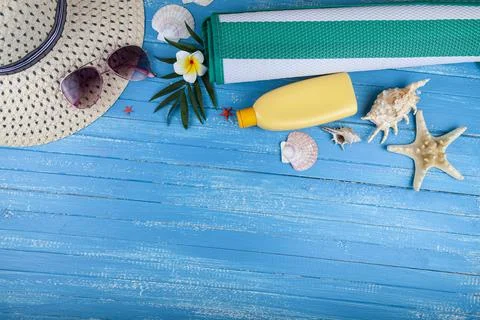 Flat lay composition with sunscreen, glasses, hat and seashells Stock Photos