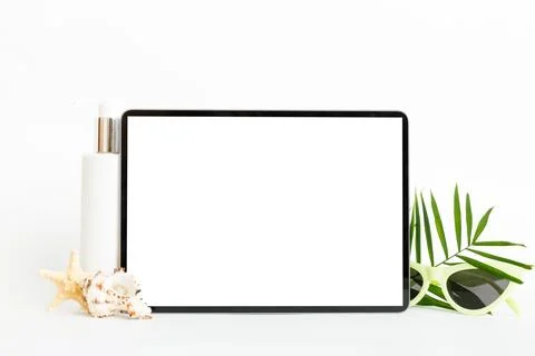 Flat lay composition with tablet and beach accessories on colored backgroun.. Stock Photos