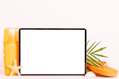 Flat lay composition with tablet and beach accessories on colored backgroun.. Stock Photos