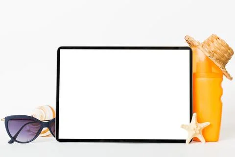 Flat lay composition with tablet and beach accessories on colored backgroun.. Stock Photos