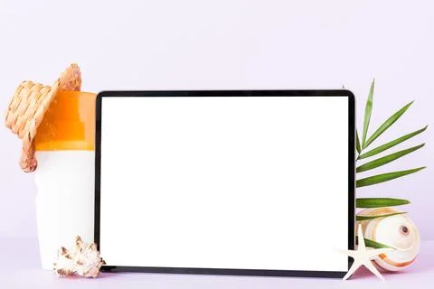 Flat lay composition with tablet and beach accessories on colored backgroun.. Stock Photos