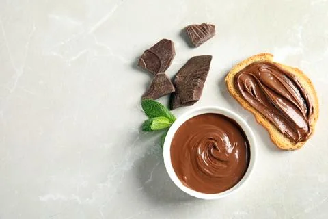 Flat lay composition with tasty chocolate mousse, bread and mint on table. Sp Stock Photos