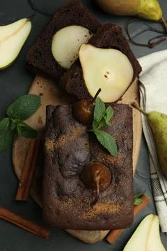 Flat lay composition with tasty pear bread on black table. Homemade cake Stock Photos