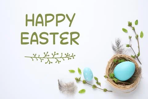 Flat lay composition with text Happy Easter and eggs on white background Stock Photos
