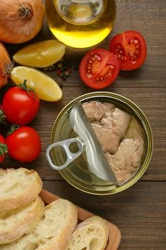 Flat lay composition with tin can of tasty cod liver and different products.. Stock Photos