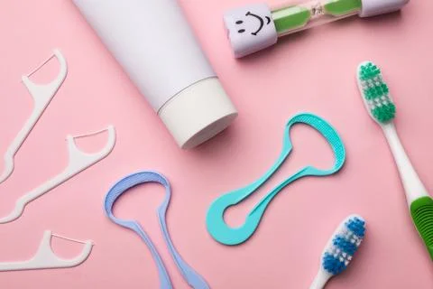 Flat lay composition with tongue cleaner on color background Stock Photos