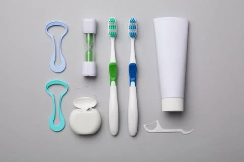 Flat lay composition with tongue cleaner on color background Stock Photos