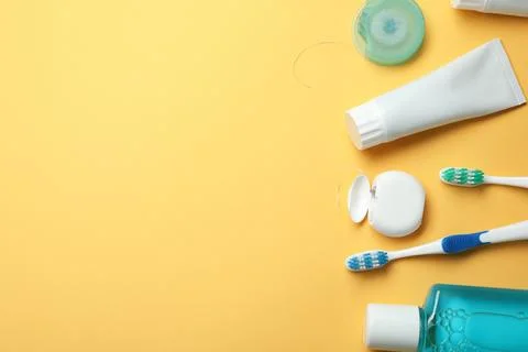 Flat lay composition with toothpaste, oral hygiene products and space for tex Stock Photos