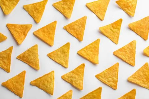 Flat lay composition of tortilla chips (nachos) on white background 库存照片