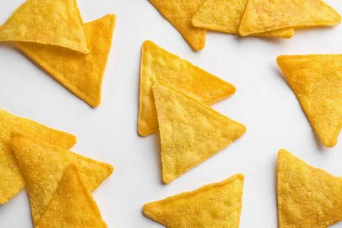 Flat lay composition of tortilla chips (nachos) on white background 库存照片