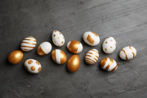 Flat lay composition of traditional Easter eggs decorated with golden paint o Stock Photos