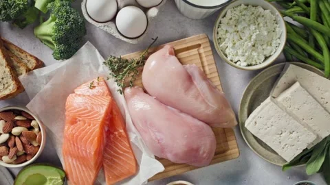 Flat lay composition of various fresh protein diet products on grey backgroun Stock Footage 317263560