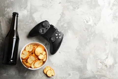 Flat lay composition with video game controller and space for text on grey ba Stock Photos