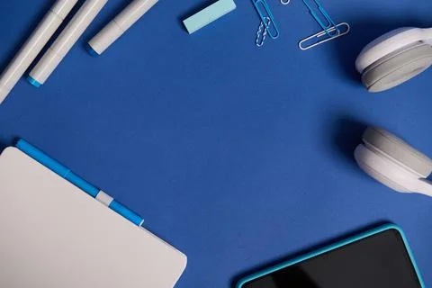 Flat lay composition with white stationery office or school supplies and elec Fotos de archivo