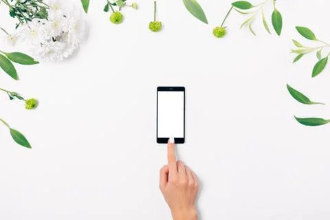 Flat lay composition woman's hand touches finger blank screen Stock Photos