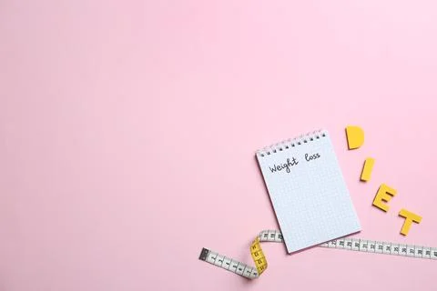 Flat lay composition with word "DIET" and space for text on color background. Stock Photos