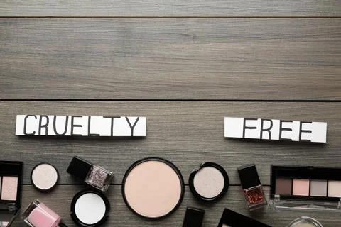Flat lay composition with words Cruelty Free and different cosmetic products  Stock Photos