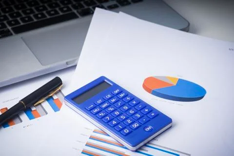 Flat lay composition of a work desk with papers, pen and calculators Stock Photos