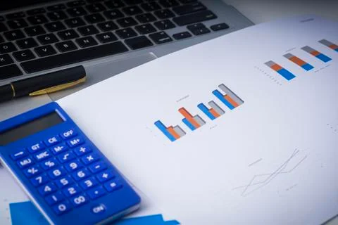 Flat lay composition of a work desk with papers, pen and calculators Stock Photos