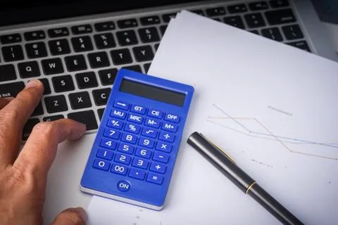 Flat lay composition of a work desk with papers, pen and calculators Stock Photos