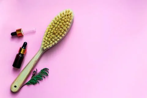 Flat lay concept of caring for your body. Anti-cellulite dry massage brush Stock Photos