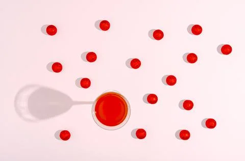 Flat lay concept. Light pink background. Red glittery Christmas balls Stock Photos