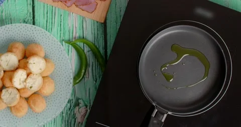 Flat lay cooking: chef adds oil to the hot pan, 4k Stock Footage 218973747